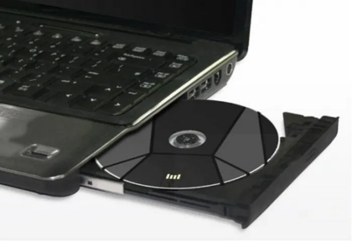 Поместите диск на блок ноутбука и сначала откройте его.